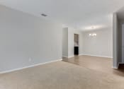 Thumbnail 22 of 24 - a bedroom with hardwood floors and grey walls