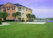 Thumbnail 27 of 33 - sand volleyball and lake at Legacy at Crystal Lake Apartments in Port Orange, Florida