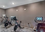 Thumbnail 23 of 50 - yoga studio and spin bikes at Tapestry Overbrook in McDonough, Georgia