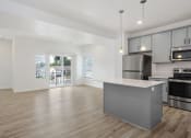Thumbnail 9 of 22 - Kitchen with View to Balcony