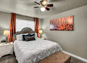 Thumbnail 8 of 12 - a bedroom with a bed and a ceiling fan