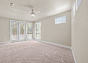 Thumbnail 3 of 23 - Spacious bedroom with patio doors and carpet at Matilda at Lower Greenville Apartments, Dallas, 75206
