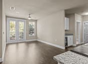 Thumbnail 9 of 23 - Open living area with patio access and hardwood floors at Matilda at Lower Greenville Apartments, Texas