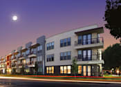 Thumbnail 19 of 23 - Modern apartment building exterior at twilight at Matilda at Lower Greenville Apartments, Dallas, TX 75206
