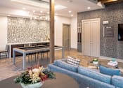 Thumbnail 18 of 25 - Community clubhouse with lounge and game table at Avion at West Lemmon Apartments, Texas, 75235
