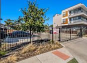 Thumbnail 21 of 25 - Modern apartment building with secured parking area at Avion at West Lemmon Apartments, Dallas, TX