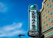 Thumbnail 20 of 23 - Vintage bottle shop neon sign in urban setting at Matilda at Lower Greenville Apartments, Dallas, 75206