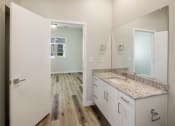 Thumbnail 23 of 29 - a bathroom with a large mirror and a large sink