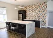 Thumbnail 12 of 26 - Large Island Countertop with Seating. Equipped with sink and refrigerator