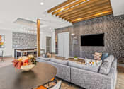 Thumbnail 17 of 25 - Open living room with wood beam ceiling accents at Avion at West Lemmon Apartments, Dallas, TX 75235
