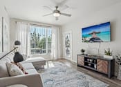 Thumbnail 5 of 24 - Living Room with Flat Screen TV at V on Broadway Apartments, Tempe, Arizona