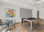 Thumbnail 19 of 25 - Game room with pool table and seating at Avion at West Lemmon Apartments, Dallas, 75235