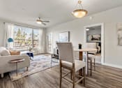 Thumbnail 3 of 24 - Living Room with Large Window at V on Broadway Apartments, Tempe, AZ
