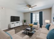 Thumbnail 10 of 18 - A living room with a white couch, a coffee table, and a flat screen TV mounted on the wall. at Stonebridge, Phoenix, AZ, 85032