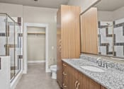 Thumbnail 12 of 23 - Spacious master bathroom with dual vanity and walk in shower at Matilda at Lower Greenville Apartments, Dallas