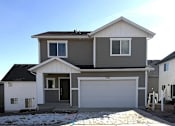Thumbnail 10 of 24 - A two-story house with a garage is numbered 643.