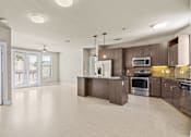Thumbnail 1 of 23 - Open floor plan with modern kitchen and island at Matilda at Lower Greenville Apartments, Dallas