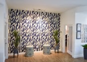 Thumbnail 13 of 26 - Navy Blue and Ivory Wall with trendy modern stools outside of leasing office
