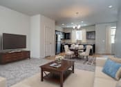 Thumbnail 3 of 17 - Living room with TV at The Village at Church & Main, Layton, UT
