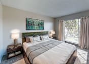 Thumbnail 5 of 11 - a bedroom with a large bed and a window