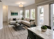 Thumbnail 4 of 26 - Open concept living and dining area with balcony at Cortina Apartments, Phoenix, 85022