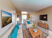 Thumbnail 5 of 11 - a living room with a couch and a table