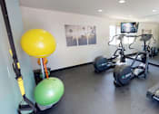 Thumbnail 10 of 12 - Stationary bikes, treadmill reflected in mirrored wall of fitness center