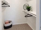 Thumbnail 10 of 23 - Walk-in closet with carpet and wire shelving at Gentrys Walk Apartments, Arizona