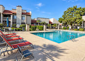 Thumbnail 23 of 23 - Resort style swimming pool with lounge chairs at Gentrys Walk Apartments, Arizona, 85204
