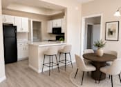 Thumbnail 3 of 26 - Kitchen and dining area with modern furnishings at Cortina Apartments, Phoenix, Arizona