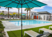 Thumbnail 3 of 29 - our apartments have a pool and lounge chairs with an umbrella