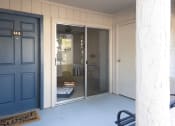 Thumbnail 13 of 25 - Large patio in front of apt showing sliding glass door leading to living space
