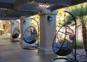 Thumbnail 16 of 25 - swing chairs by pool area