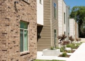 Thumbnail 8 of 14 - exterior townhome flowers.
