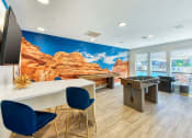 Thumbnail 4 of 25 - Clubhouse and Game Room with Plank Flooring and Large Windows Looking out to the Pool at Enclave at Paradise Valley, Arizona