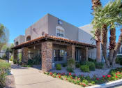 Thumbnail 1 of 18 - Leasing Office with Stone Pillars and Manicured Landscaping at Stonebridge, Phoenix, Arizona  85032