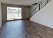 Thumbnail 4 of 11 - Living room with view of stairs leading upstairs