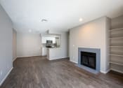 Thumbnail 18 of 25 - Spacious Living Room with Plank Flooring and a Fireplace at Enclave at Paradise Valley, Phoenix, AZ
