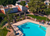 Thumbnail 22 of 25 - Aerial view of pool and green space surrounding pool area