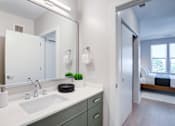 Thumbnail 27 of 29 - A bathroom with a white sink and a mirror above it.at The Ace, Richmond, 23230