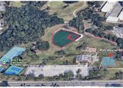 Thumbnail 13 of 14 - An aerial view of a baseball field surrounded by trees and other buildings.