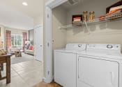 Thumbnail 10 of 12 - the washer and dryer in the laundry room of a house