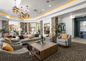 Thumbnail 1 of 15 - a living room with couches and chairs and a coffee table