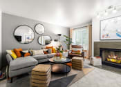 Thumbnail 9 of 15 - a living room with a gray couch