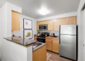 Thumbnail 11 of 15 - our apartments offer a modern kitchen with stainless steel appliances