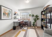 Thumbnail 15 of 15 - an office with a desk and a window and a plant