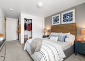 Thumbnail 12 of 15 - a bedroom with a bed and a closet