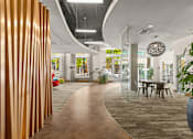 Thumbnail 15 of 20 - a dining area with a table and chairs in a lobby
