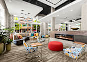 Thumbnail 16 of 20 - the lobby of a hotel with a fireplace and seating