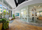 Thumbnail 17 of 20 - the lobby of a building with a large peace sign in the middle